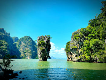 Scenic view of lake against clear blue sky