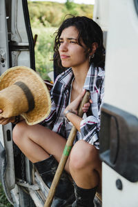 Full length of woman sitting in bus