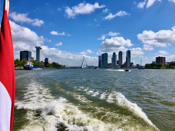 Scenic view of sea and buildings against sky