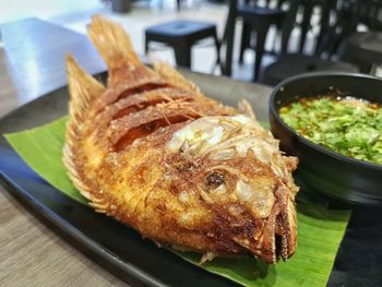 High angle view of fish in plate on table