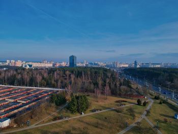 High angle view of trees and buildings against sky