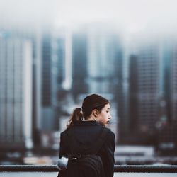 Woman standing in city