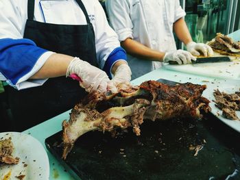 Midsection of man preparing food