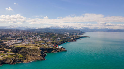 Aerial view of bay against sky