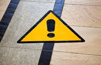 Close-up of yellow road sign