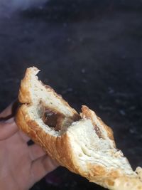 Close-up of hand holding bread