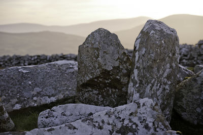 Close-up of rock against sky during winter