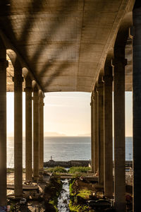 Bridge over sea against sky