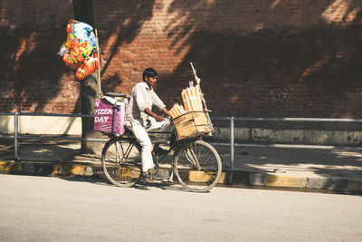 People riding bicycle on street