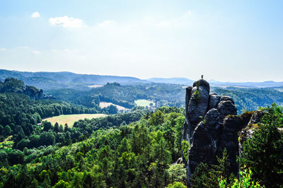 Statue on mountain against sky