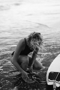 Woman looking at sea shore