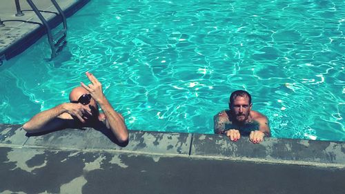 High angle view of man swimming in pool