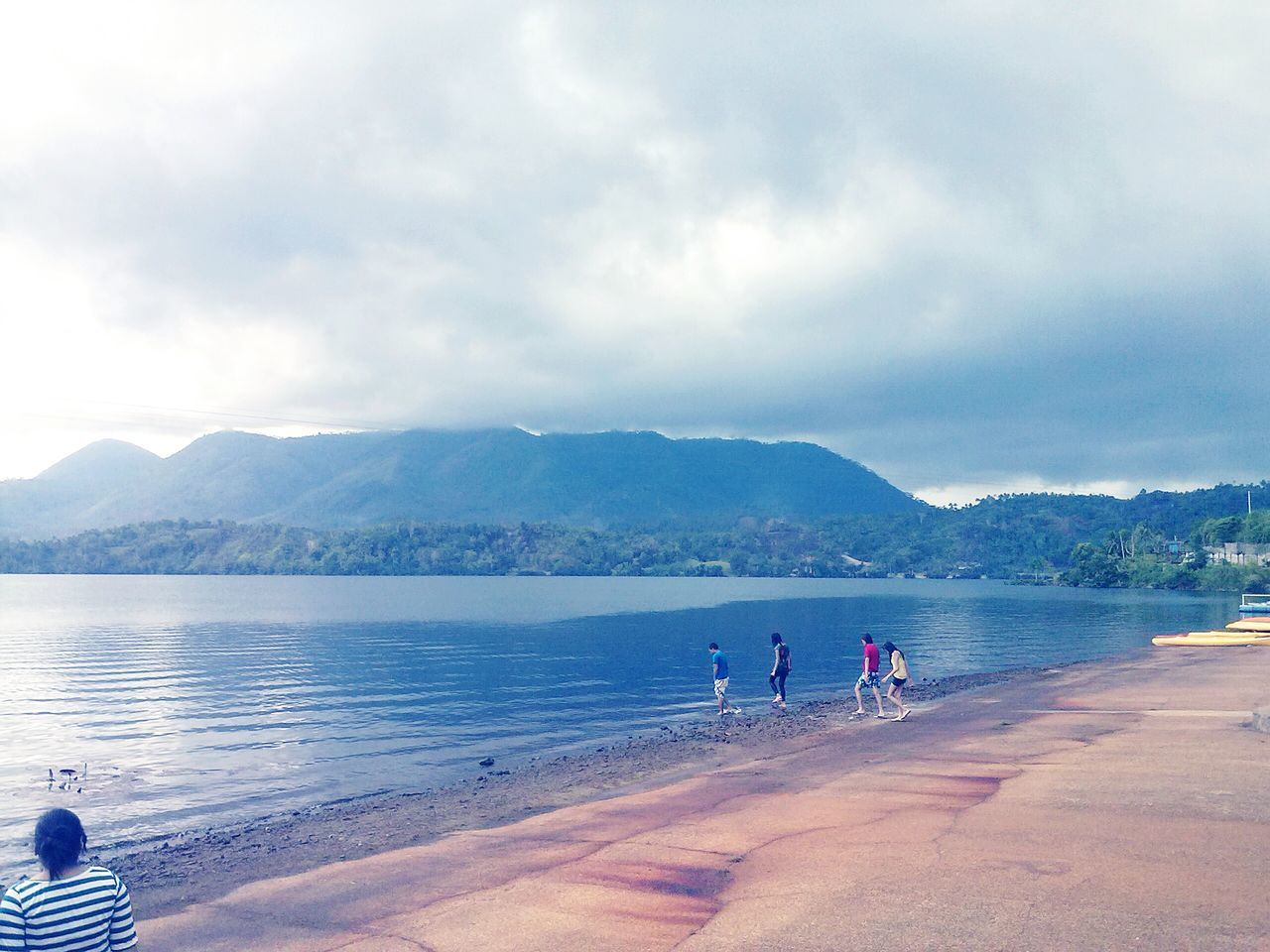 sky, water, beach, cloud - sky, lifestyles, leisure activity, mountain, sea, shore, men, cloudy, scenics, vacations, nature, sand, person, beauty in nature, tranquil scene, tranquility