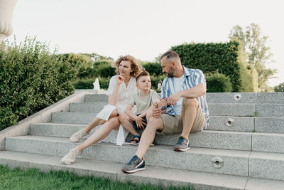 Portrait of woman sitting on steps