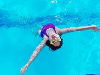 Girl swimming in pool