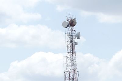 Low angle view of communications tower against sky