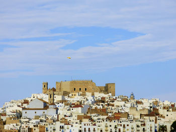 Residential district against blue sky