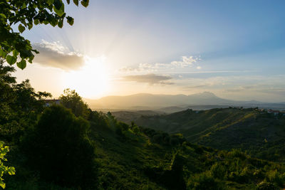 Scenic view of landscape against sky during sunset