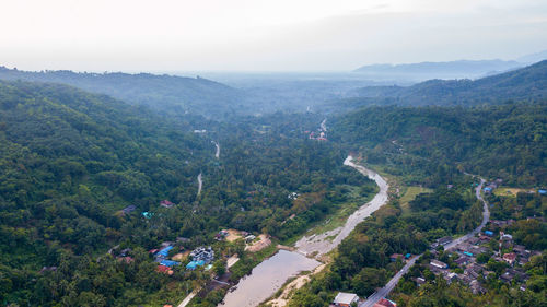 High angle view of trees and mountains against sky