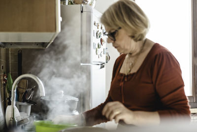 Senior woman preparing food