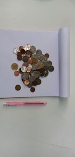 High angle view of coins on table