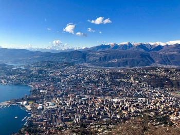 High angle view of cityscape against blue sky