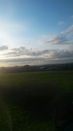 Scenic view of landscape against cloudy sky