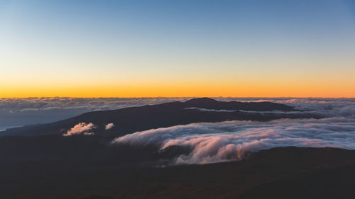 Scenic view of mountain against sky during sunset