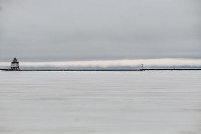 Scenic view of sea against sky during winter