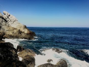 Scenic view of sea against clear blue sky