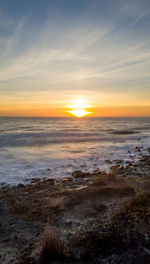 Scenic view of sea against sky during sunset