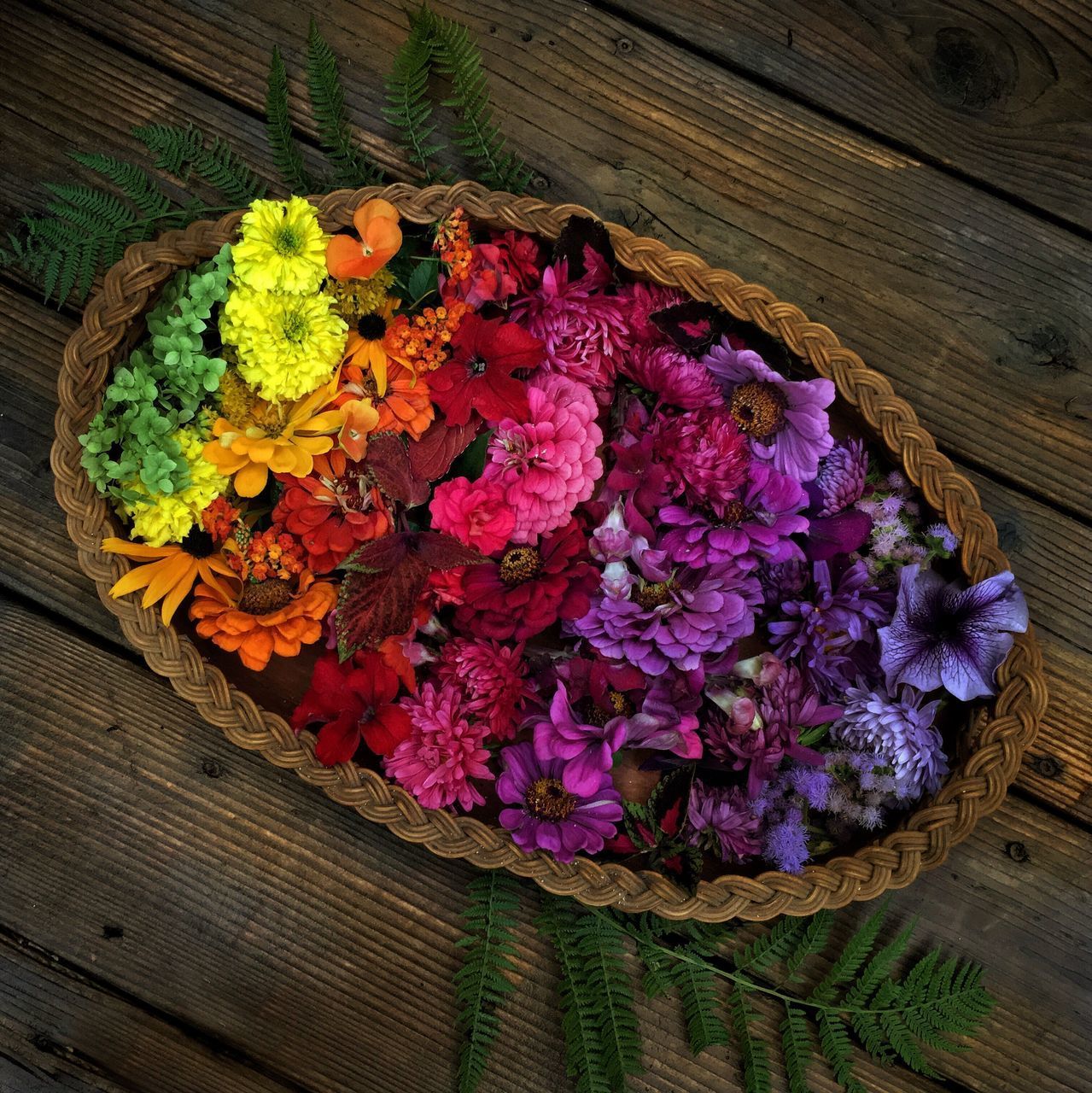 CLOSE-UP OF FLOWERS IN BASKET