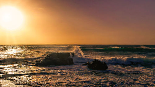 Scenic view of sea against sky during sunset