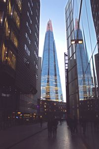 Low angle view of skyscrapers against sky