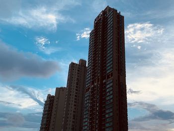 Low angle view of modern buildings against sky