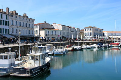 Boats moored at harbor