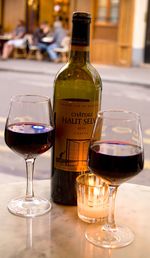 Close-up of wine glasses on table