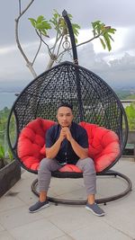 Portrait of man sitting outdoors