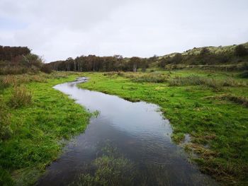 Scenic view of river against sky