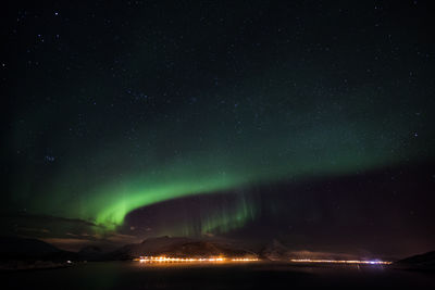 Scenic view of northern lights against star sky