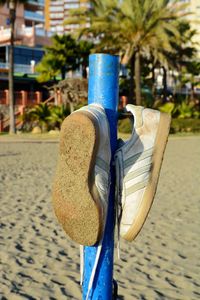 Close-up of metal container on beach