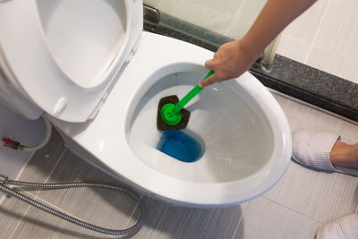 High angle view of person washing hands in bathroom