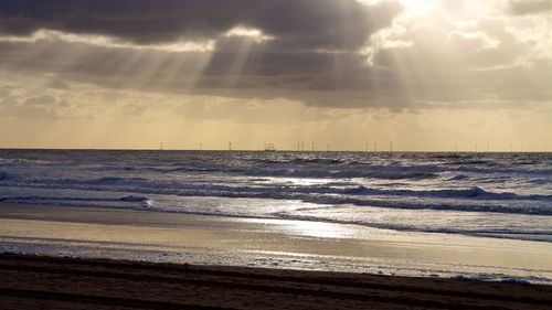 Scenic view of calm sea at sunset