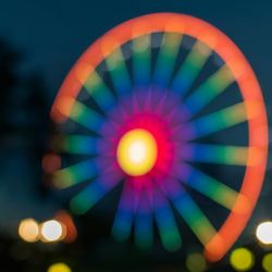 Low angle view of illuminated lights at night