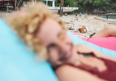 Portrait of people relaxing on beach