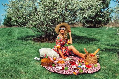 Portrait of smiling woman sitting in basket