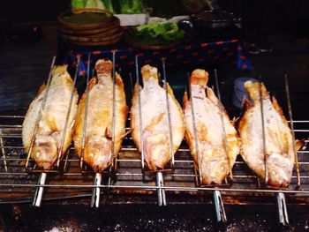 High angle view of meat on barbecue grill