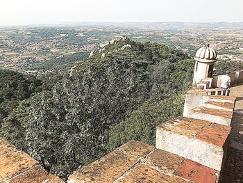 High angle view of trees and buildings against sky