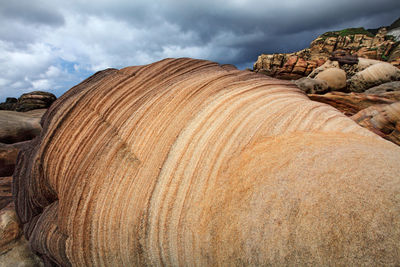 Panoramic view of rocks on land against sky