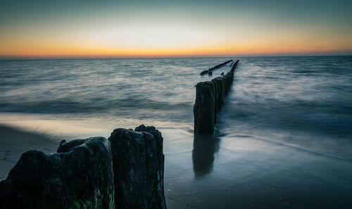 Scenic view of sea against sky during sunset